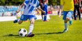 Running Youth Soccer Football Players. Boys Kicking Soccer Match