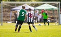 Running Youth Soccer Football Players. Boys Kicking Soccer Match