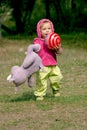 Runnung toddler with a ball Royalty Free Stock Photo