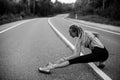 Runnung woman warm-up before jogging. Black and white photo.