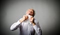 Runny nose. Old man is sneezing. Royalty Free Stock Photo
