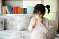 Runny nose. Sick little girl blowing her nose Royalty Free Stock Photo