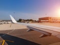 At runway. Aircraft in airport terminal with clean blue sky back