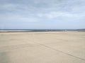 Runway, Airport pavement close up. Seaside airport runway background. View to empty airport runway. Aeronautical engineering