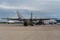 Runway with a lot of planes, including black military aircraft transall c160 Royalty Free Stock Photo