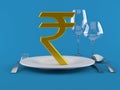 Rupee currency symbol with plate and cutlery