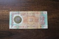 10 rupee old note with coin