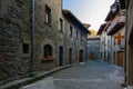 RUPIT, CATALONIA, SPAIN April 2016: view of the medieval town of Rupit- street with brutal rustic medieval houses