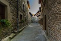 RUPIT, CATALONIA, SPAIN April 2016: A view of the medieval town of Rupit street with brutal rustic medieval houses