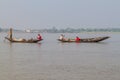 RUPSA, BANGLADESH - NOVEMBER 13, 2016: Local men on small boats on Rupsa river, Banglade