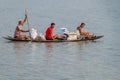 RUPSA, BANGLADESH - NOVEMBER 15, 2016: Three men on a small conoe on Rupsa river, Banglade Royalty Free Stock Photo