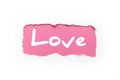 A rupture in a white background with torn edges. The inscription `love` on a pink background.