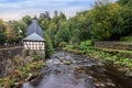 Rur river along the city park of the historic old town in Monschau, Germany.