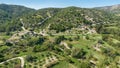 Rural depopulation, abandoned village with olive and carob trees gardens