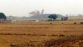 Rural Area having stone crusher working in background