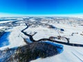 Rural area after heavy snowfall on bright sunny day, aerial landscape. Sunny morning in winter Royalty Free Stock Photo