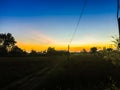 The Rural Area in the Morning with sunrise background and foreground with electric cables. This is for the electricity and