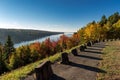 Rural asphalt road in New England surrounded by autumn trees Royalty Free Stock Photo