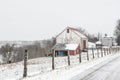 Rural barn and farmhouse in a snow storm Royalty Free Stock Photo