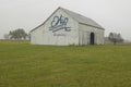 A rural barn with large Ohio Bicentennial 1803Ã¯Â¿Â½2003 painted on side