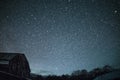 Rural barns at night with stars in winter Royalty Free Stock Photo