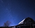 Rural barns at night with stars in winter Royalty Free Stock Photo