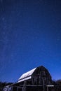 Rural barns at night with stars in winter Royalty Free Stock Photo