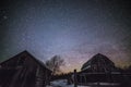 Rural barns at night with stars in winter Royalty Free Stock Photo