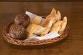 Rural bread with spices and sesame seeds in a wicker basket Royalty Free Stock Photo