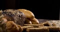 Rural bread and wheat on an old antique wooden table, still life Royalty Free Stock Photo