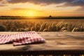 Rural charm Wooden table against wheat field at sunset, ideal for displays