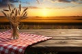 Rural charm Wooden table against wheat field at sunset, ideal for displays