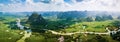 Rural Chinese landscape of limestone rocks and scenic river around rice fields