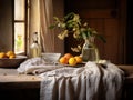 Rural cottage style kitchen filled with natural light with rough walls and wooden finishes. Linen table cloth and flowers on the Royalty Free Stock Photo