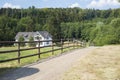 Rural cottage with wooden fence in the middle of the forest in Koblenz, Germany