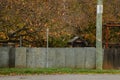 Rural country Australian scene with outdoor dunny visible over tin fence