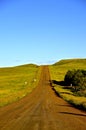 Rural country road covered with scoria Royalty Free Stock Photo