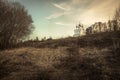 Rural countryside scenery landscape with church on hill and sunset sky in springtime season Royalty Free Stock Photo