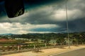 Rural Countryscape under Rainy Clouds out of Bus Window Royalty Free Stock Photo