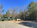 A rural county public waste trash dump for local residents trash pile toilet tire waste distant view