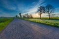 Rural destroyed asphalt road in calm countryside Royalty Free Stock Photo