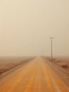 Rural dirt road stretching into the distance and disappearing into the mist. Dusty and monotonous landscape. Generative AI Royalty Free Stock Photo