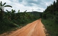 Rural dirt road to the mountains Royalty Free Stock Photo