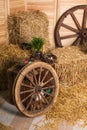 Rural easter decorating. Hay and wooden cart wheel