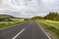 Rural Eifel landscape with road and green meadow