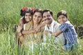 Rural family of farmer on agriculture field