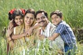 Rural family of farmer on agriculture field