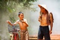 Rural family happiness. Grandfather and grandchildren walking on a bicycle to talk