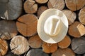 Rural farming background with collective farmer`s wicker hat on a wood