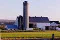 Rural farmstead featuring an old wooden barn in the background